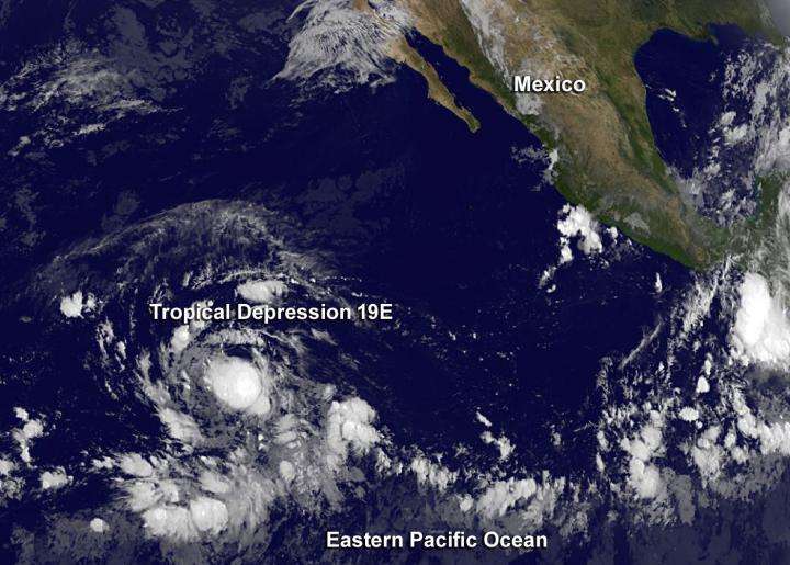 Satellite sees Tropical Depression 19E still disorganized