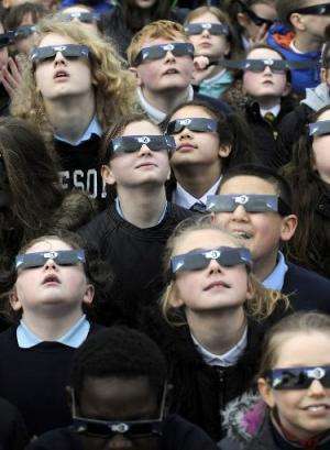 School children gather to view the partial solar eclipse at the Glasgow Science Centre in Glasgow, Scotland on March 20, 2015