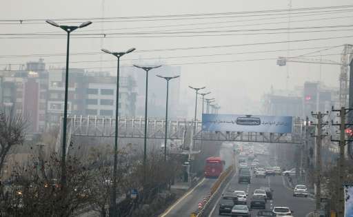 The heavily polluted skyline of Tehran pictured from the west of Iranian capital on December 14, 2015