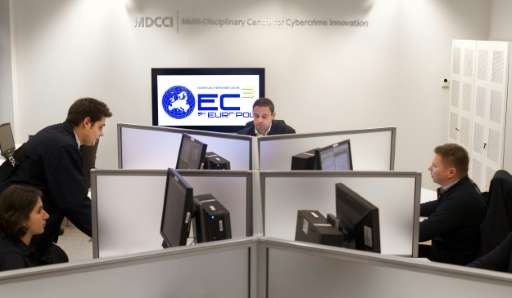 Employees of the European Cybercrime Centre work on January 11, 2013 in The Hague