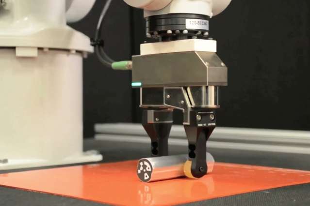 Engineers use the environment to give simple robotic grippers more dexterity