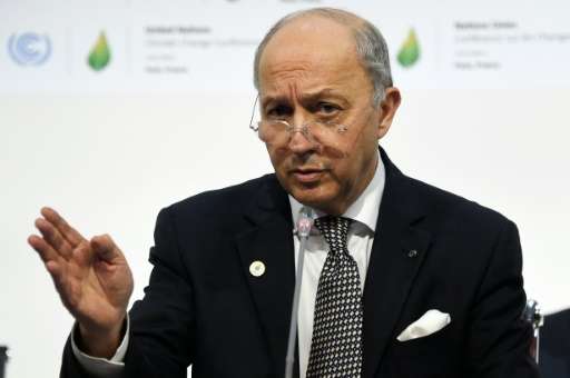 French Foreign Minister Laurent Fabius takes part in a plenary session at the COP21 United Nations climate change conference in 
