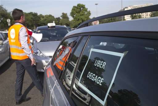French taxis strike after weeks of rising tension over Uber
