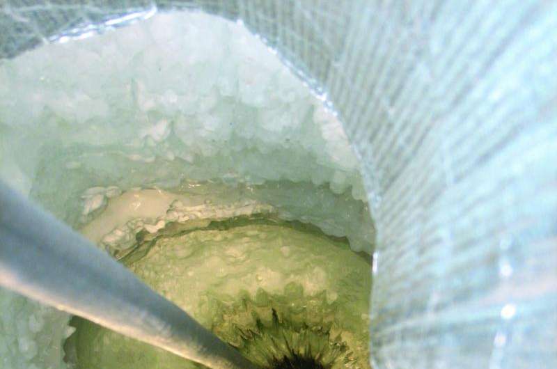Scientist at work: searching for tiny neutrinos in the South Pole's thick ice