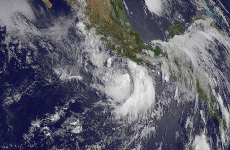Tropical storm Carlos lingering off Mexico's southwestern coast