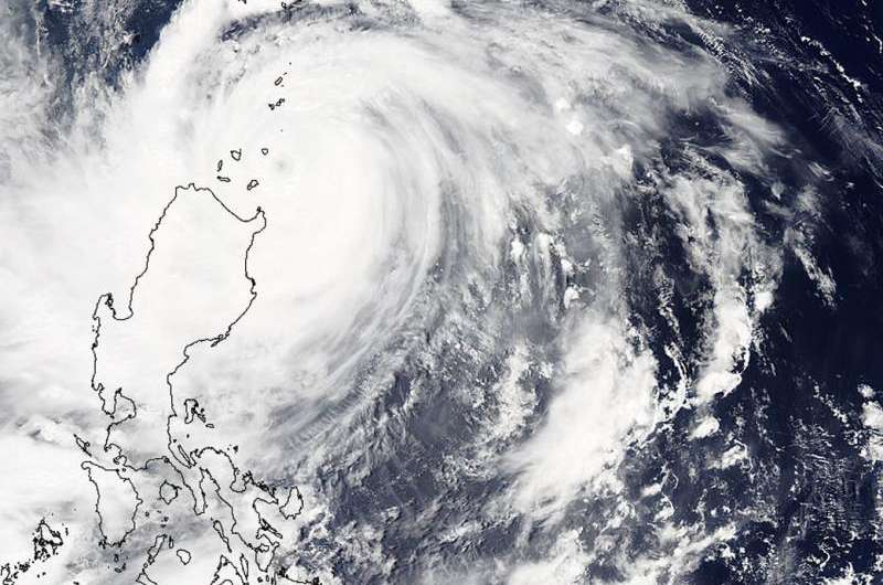 Two NASA satellites see powerful Typhoon Goni brush the Philippines