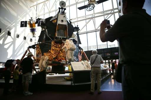 Visitors look at the exhibit of one of the 12 Apollo Lunar Modules that was built for the moon-landing program, August 31, 2012 