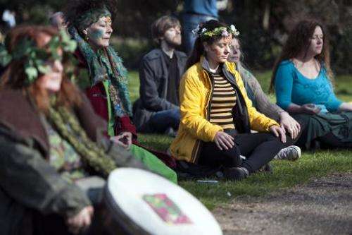 Demonstrators meditate before taking part in the People's Climate March in central London on March 7, 2015
