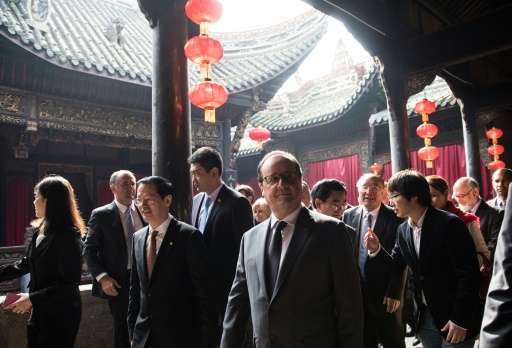 French President Francois Hollande visits the Huguang Guild Hall in Chongqing, on November 2, 2015