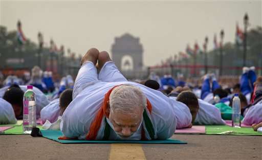 Millions across India, world bend and twist in 1st Yoga Day