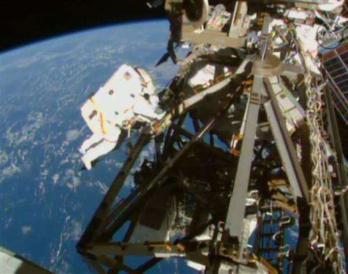 Spacewalking astronauts finish extensive, tricky cable job