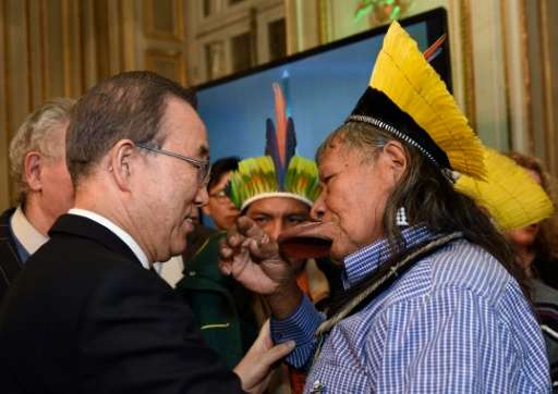UN Secretary General Ban Ki-moon speaks with Brazilian indigenous rights activist and chief of the Kayapo Amazonian Indian tribe