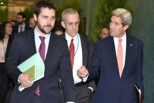 US Secretary of State John Kerry (R) walks with White House senior advisor Brian Deese (L) and US Special Envoy for Climate Chan