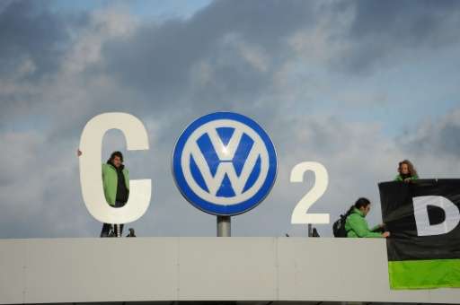 Greenpeace activists demonstrate at the entrance to the Volkswagen plant in Wolfsburg, central Germany, on November 9, 2015