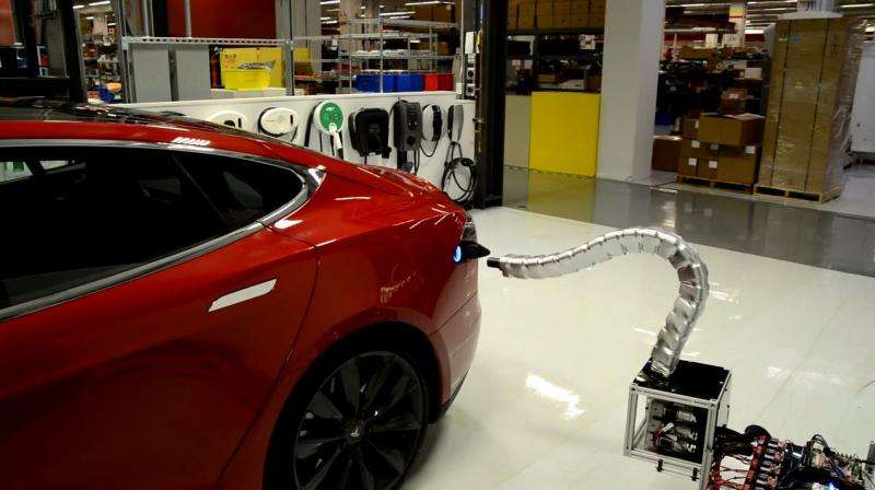 Tesla prototype is snakelike arm, guides itself into port to charge