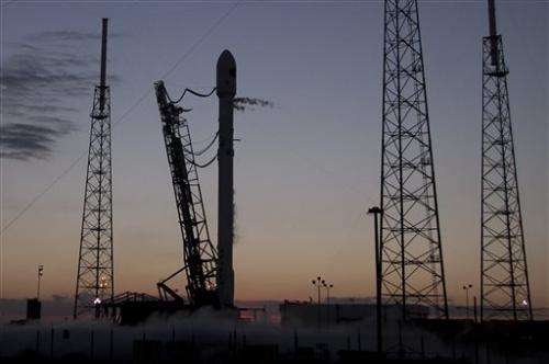 SpaceX tries again to launch observatory, land rocket at sea