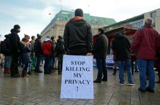 Demonstrators protests against data preservation in front of the US embassy in Berlin on February 1, 2014