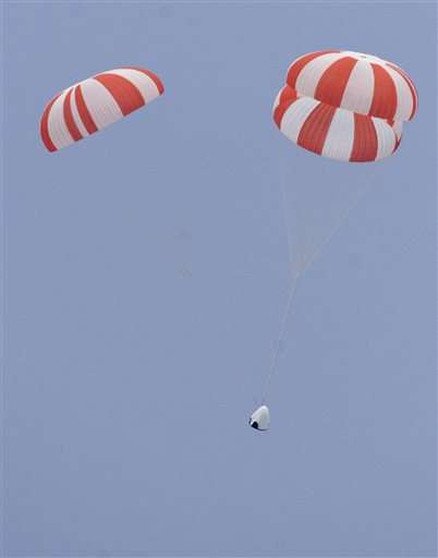 SpaceX capsule soars with dummy in first test of crew escape