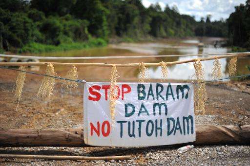 A banner reading &quot;Stop Baram Dam&quot; is seen atn the main entrance to a blockade camp opposing the proposed dam on the Ba