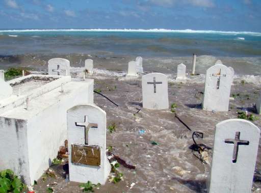 A cemetery on the shoreline in Majuro Atoll is flooded in 2008 by high tides and ocean surges in the low-lying Marshall Islands,
