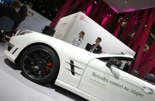 A connected Mercedes car is pictured at the booth of German telecommunication giant Telekom at the &quot;Mobility World&quot; ha