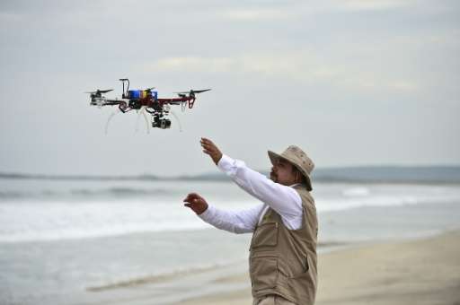 A drone is launched to keep watch over the nests of sea turtles on Morro Ayuta Beach, Oaxaca State, Mexico, on September 10, 201