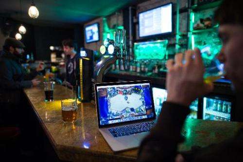A gamer drinks a beer at &quot;e-sport&quot; bar Meltdown, the only one of its kind in Britain, in north London on February 14, 