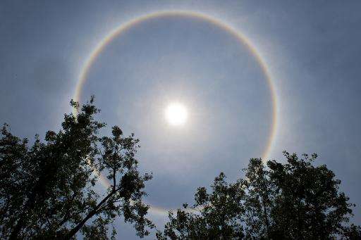 A halo around the sun is seen in the sky above Mexico City on May 21, 2015