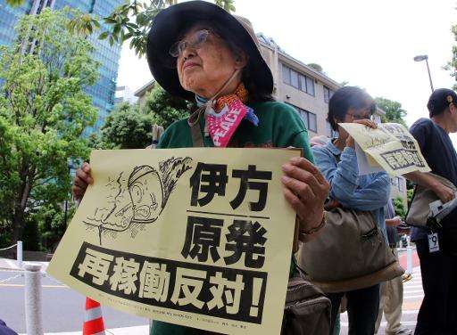 A Japanese anti-nuclear protester demonstrates outside the Nuclear Regulation Authority (NRA) in Tokyo, on May 20, 2015