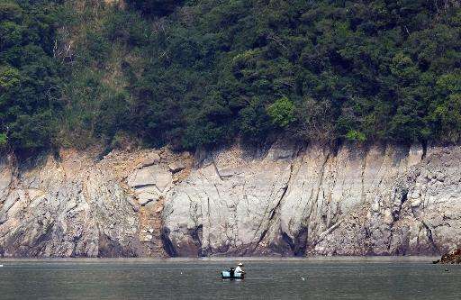 A local resident is seen fishing at Shihman dam in northern Taoyuan, on March 20, 2015