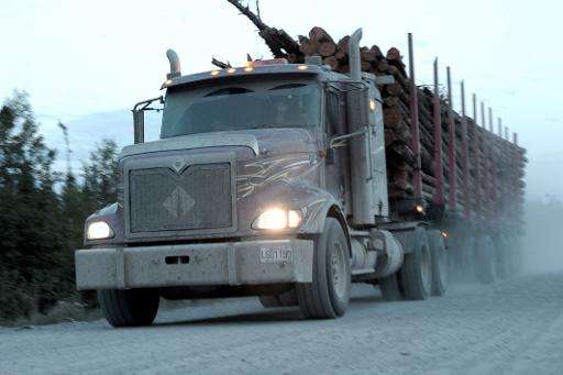 A logging truck carries wood from the boreal forest to a sawmill near the Broadback River in northern Quebec