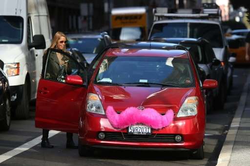 A Lyft customer gets into a car on January 21, 2014 in San Francisco, California