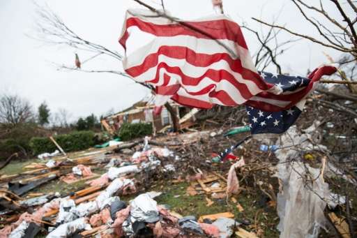 An American flag placed by first responders is seen December 27, 2015 in the aftermath of an unseasonable tornado in Rowlett, Te