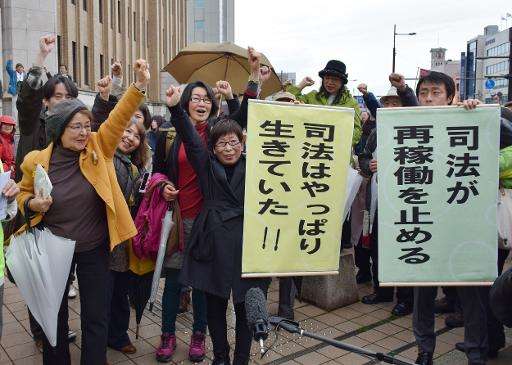 Anti nuclear activists celebrate as the Fukui district court issued a landmark injunction against the restarting of two atomic r