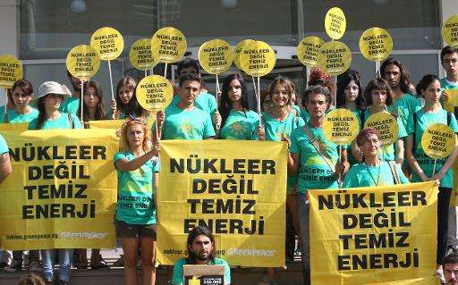 Anti-nuclear protesters demonstrate outside Turkey's energy ministry in Ankara on July 24, 2014