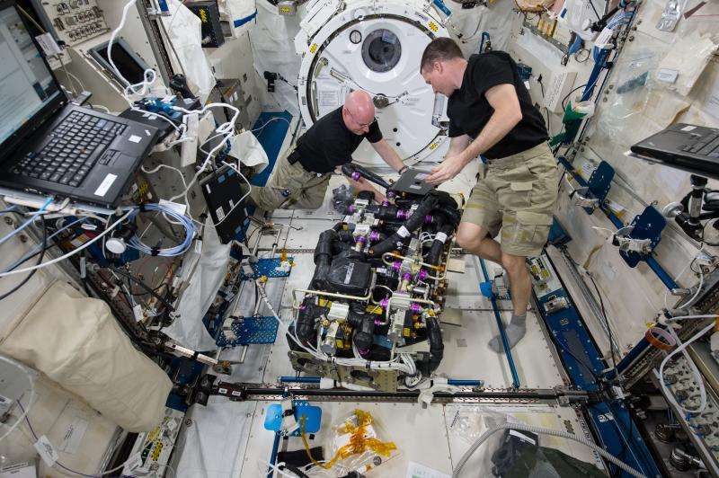 Astronauts at work on the International Space Station