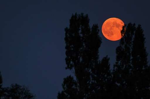 A 'supermoon' is seen from the central French city of Luynes, in September 2014