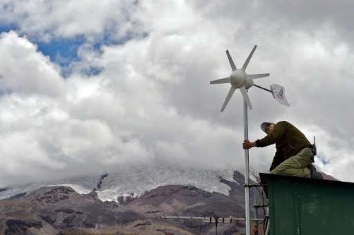 A technician of the Geophysical Institute of Ecuador installs monitoring equipment near Cotopaxi volcano on October 29, 2015