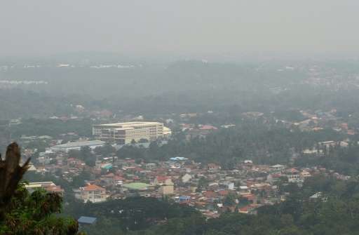 A thick haze, believed to be from Indonesia's forest fires, enguls the city of Davao on the southern island of Mindanao on Octob