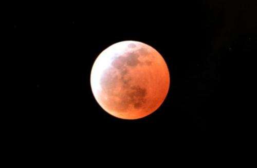 A total lunar eclipse is seen in Utsunomiya in Tochigi prefecture, 100km north of Tokyo on April 4, 2015