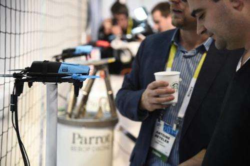 Attendees look at the Parrot BeBop Drone Quadcopter with Skycontroller, January 6, 2015 at the Consumer Electronics Show in Las 