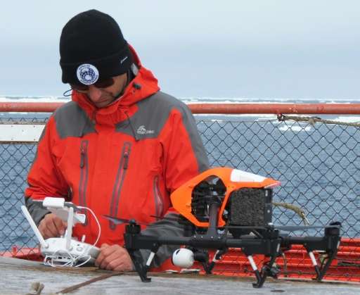 Australian UAV director James Rennie, seen with a quadcopter drone on the deck of the Australian Antarctic Division ice-breaker,