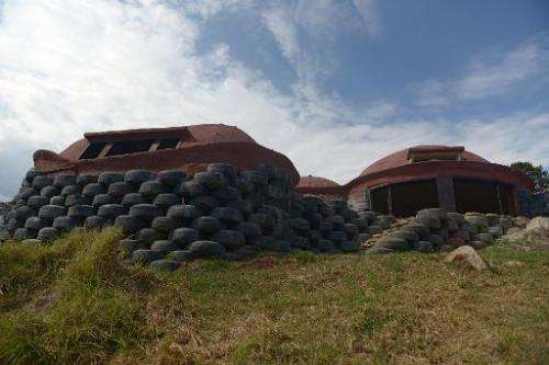 A view of a house built with discarded tires in Choachi, Cundinamarca, Colombia on March 16, 2015