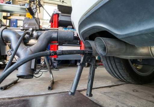 A Volkswagen Golf TDI diesel car undergoes an emissions inspection at a garage in Frankfurt am Main, eastern Germany, on Septemb