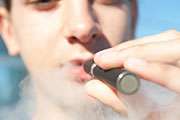 Ban flavoring, ads for E-cigarettes, doctors' group says