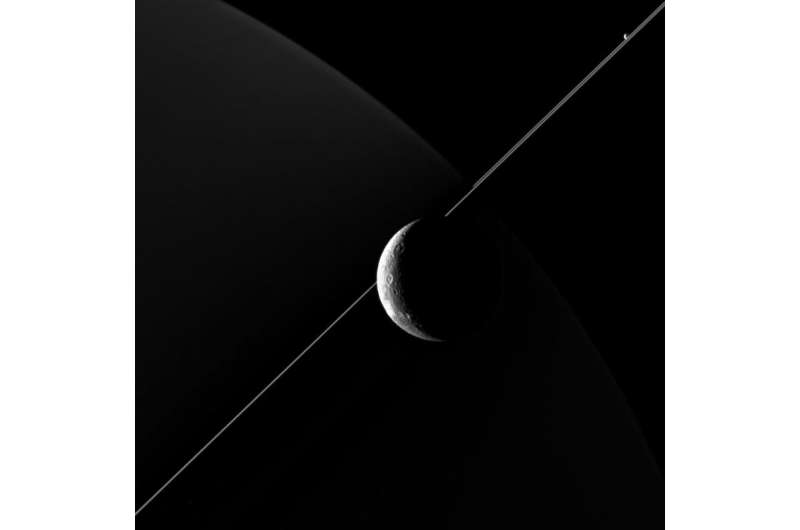 Cassini zooms past Dione