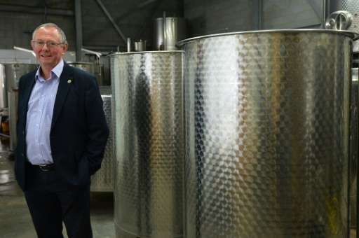 Chris Foss, Head of the Wine Department, poses for a photo in the storage area of the department, at Plumpton College in East Su
