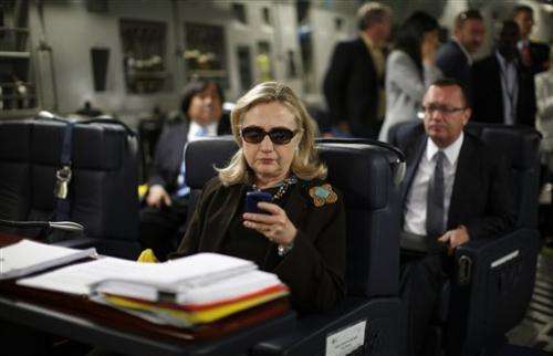 Clinton urges State Dept. to release her emails