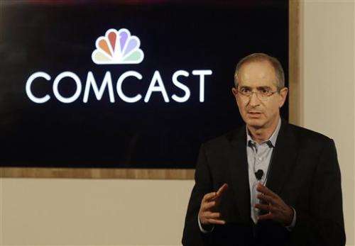 Comcast 4Q profit edges up, adds customers, boosts dividend