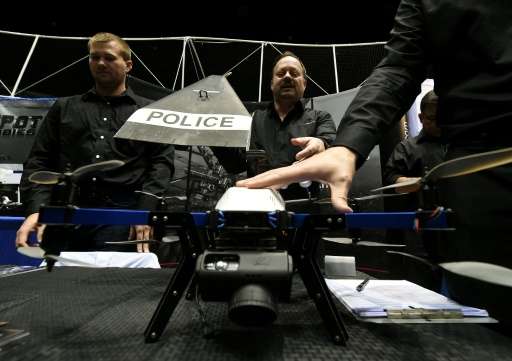 Consultants from Flyspan Solutions demonstrate a drone intended for police use, during the first-ever Drone Expo in Los Angeles,